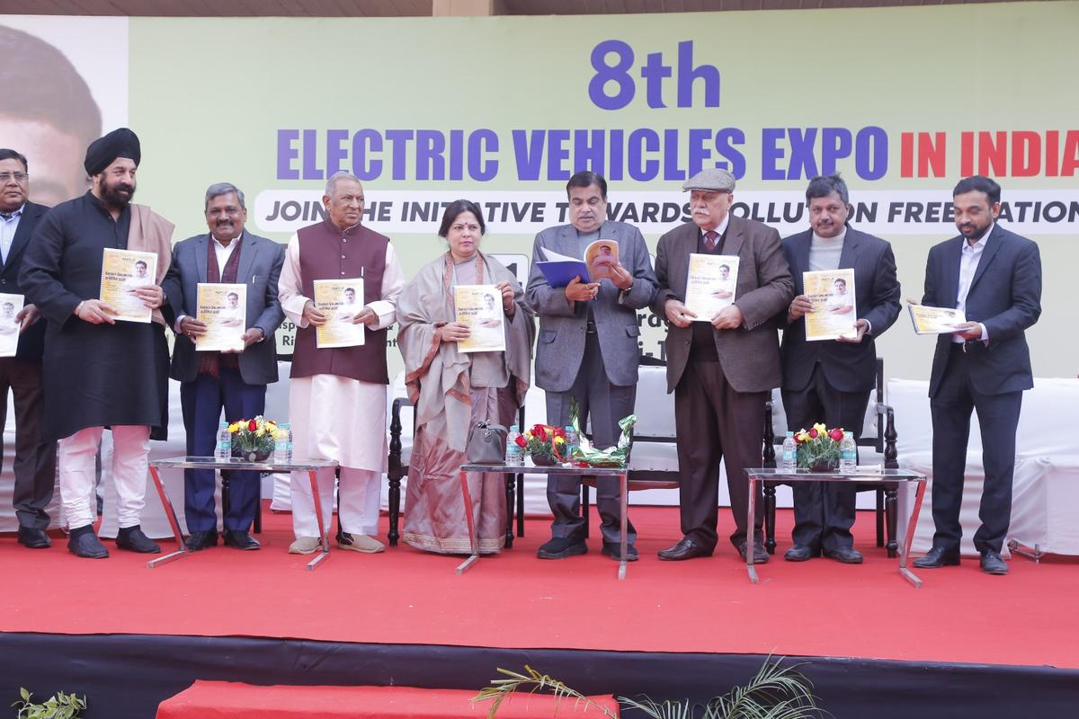 Guests presenting publications on stage at the 8th Electric Vehicles Expo in India