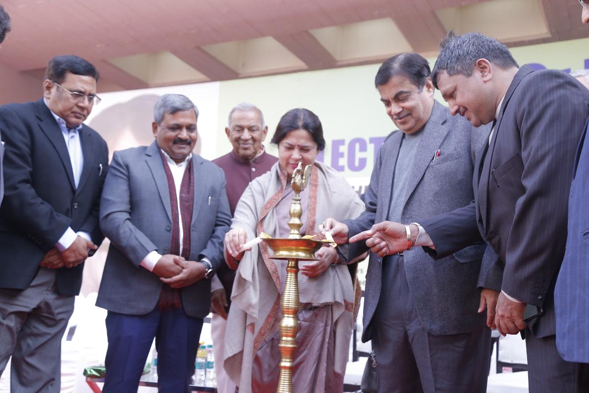 Guests lighting a ceremonial lamp at the opening of a previous EV-Expo exhibition